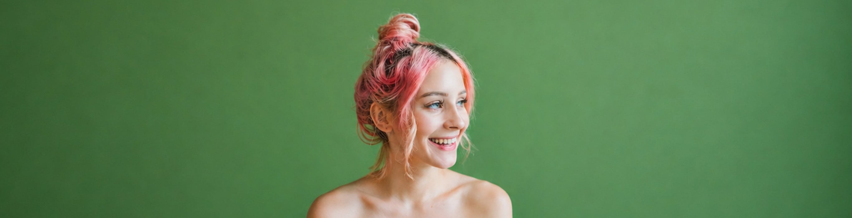 Woman with soft pink hair, illustrating healthy-looking colour refreshed without damaging the hair.